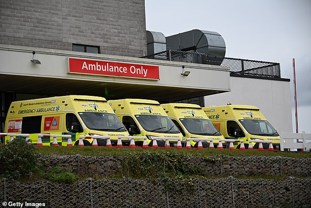 Ambulances wait outside the Emergency Department at the Royal Cornwall Hospital on January 4