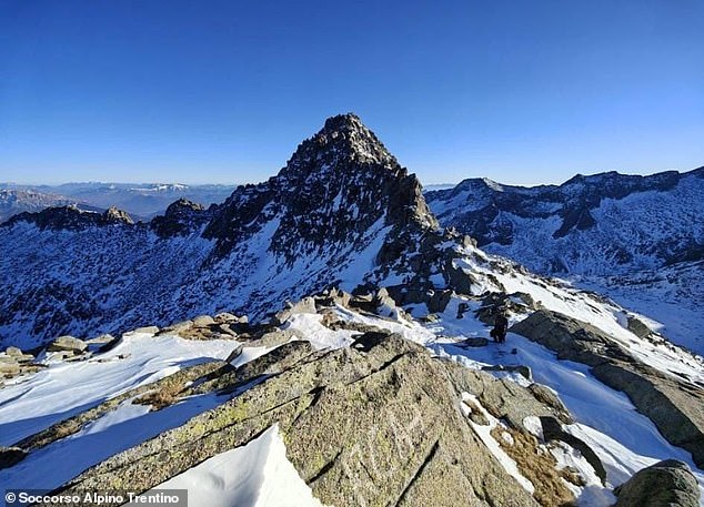 Rescuers have released pictures of their search for the two missing hikers in the Dolomites