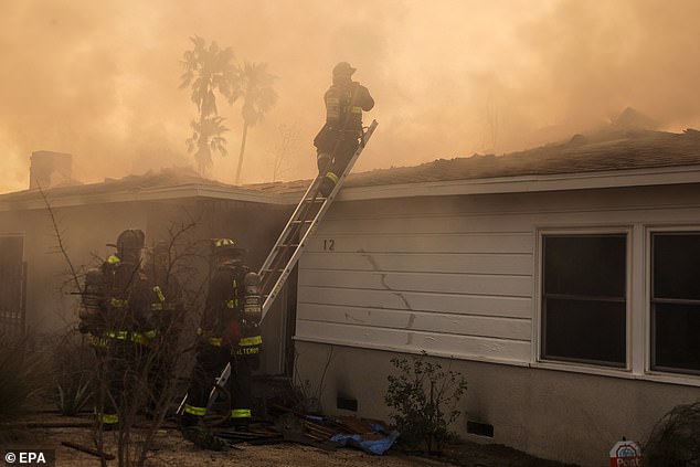 Firefighters are seen battling a blaze in Altadena