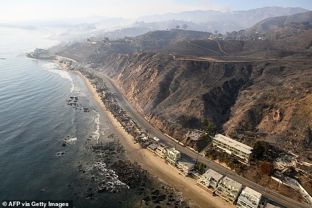 From the air the devastation is total save for a few homes that escaped the flames