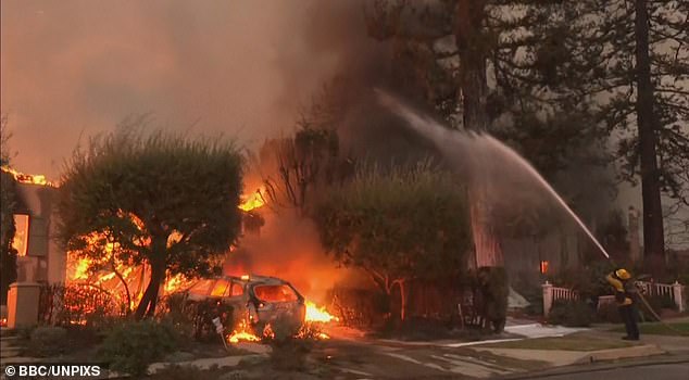 Firefighters are seen tackling one of the many blazes in the area