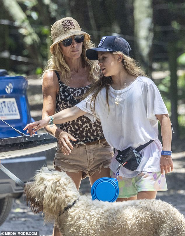 Her daughter India looked every inch her mother's mini-me as she wore a white T-shirt and pink shorts for the dog walk