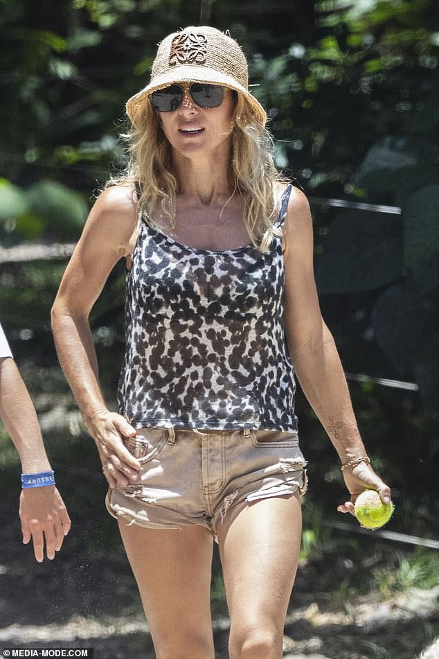 The Spanish actress, 48, put on a leggy display in distressed beige denim shorts and a black patterned vest top as she soaked up the rays during the balmy walk