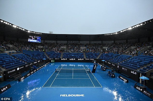 Rain has halted play on the outside courts early on day one of the Australian Open