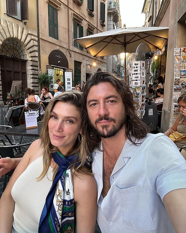 Sharing an image of the inferno engulfing the Hollywood Hills, the hitmaker said she and her partner Matthew Copley (right) had to 'temporarily evacuate' their home in the City of Angels