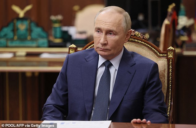 Vladimir Putin (pictured) should compete with Donald Trump to control Greenland said a Russian general