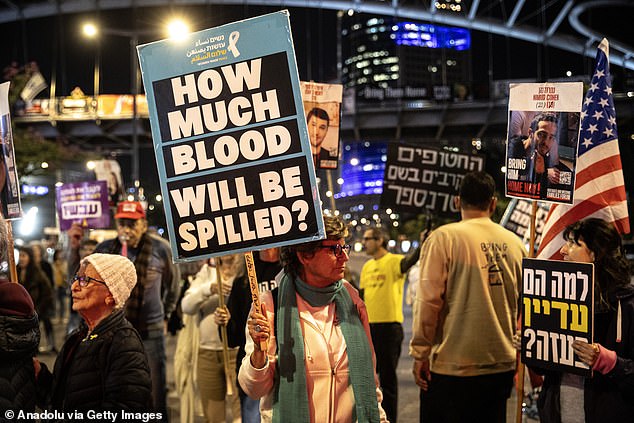 The demonstrators carried photos of their relatives and banners reading 'Stop the war'