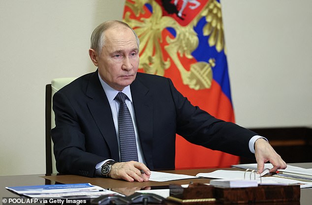 Russian President Vladimir Putin is pictured on January 15 hosting a video conference meeting