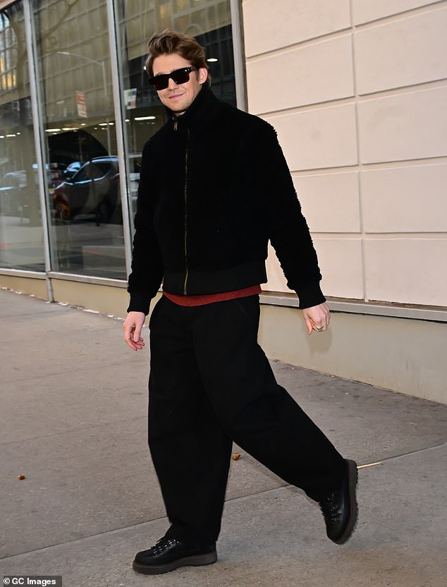 Alwyn pictured on Wednesday (pictured outside CBS Studio after filming The Drew Barrymore show) is currently busy promoting his film The Brutalist