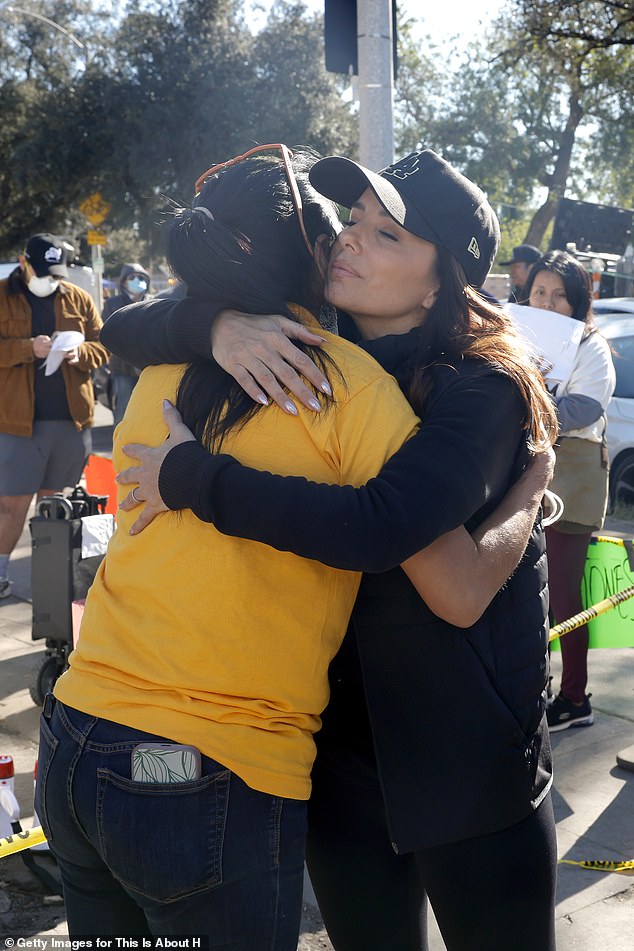 Later, she embraced fellow volunteers with big hugs