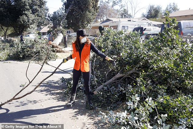 The director and producer didn't hesitate to roll up her sleeves, pitching in to help clear fallen trees from the street