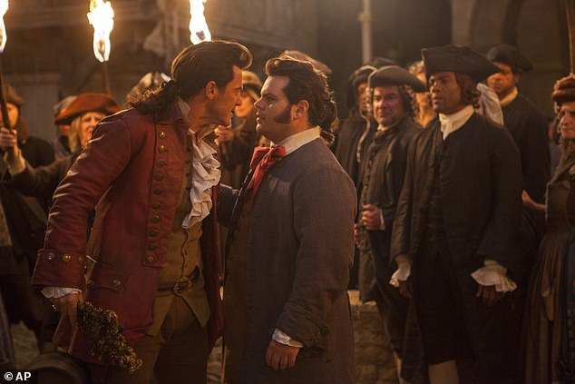 Gad's character friendly with the Gaston character played by Luke Evans (L) in the film