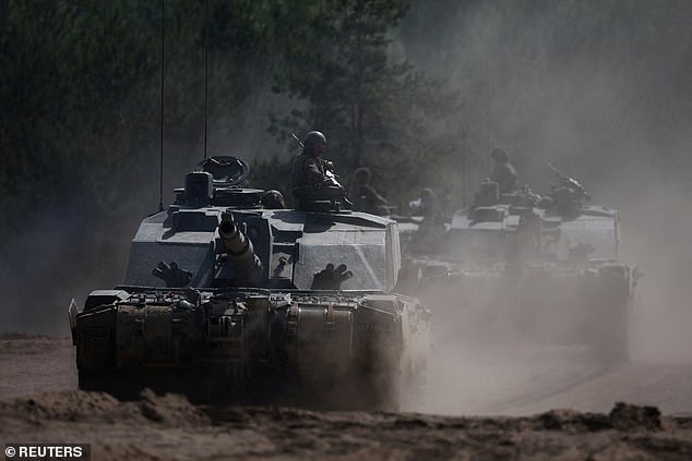 British Army soldiers ride Challenger 2 tanks during Exercise Immediate Response as one component of NATO's Exercise Steadfast Defender 2024, in Poland May 15, 2024