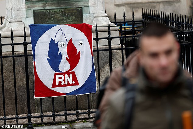 A flag of the French far-right National Rally (Rassemblement National - RN) party hangs near the Notre-Dame du Val-de-Grace church