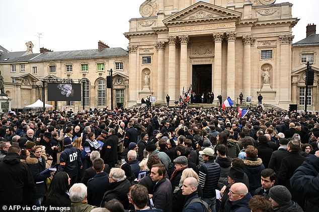 Supporters gather outside during a memorial service for French far-right figure Jean-Marie Le Pen