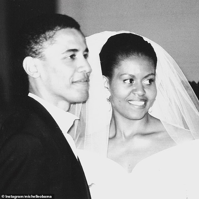 The couple met as young lawyers working for the same Chicago firm in 1989 and celebrated their 32nd wedding anniversary. Pictured: Barack and Michelle Obama's wedding in 1992 in October