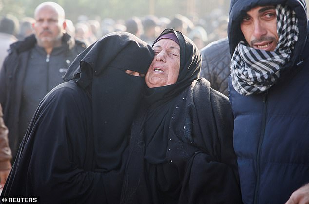 Mourners react near the bodies of Palestinians killed in Israeli airstrikes, amid the Israel-Hamas conflict, at Nasser hospital in Khan Younis, southern Gaza Strip, January 17