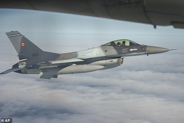 File photo. A Romanian Air Force F-16 military fighter jet escorts a C-27J Spartan aircraft during an Air Policing exercise above eastern Romania, Wednesday, March 6, 2024