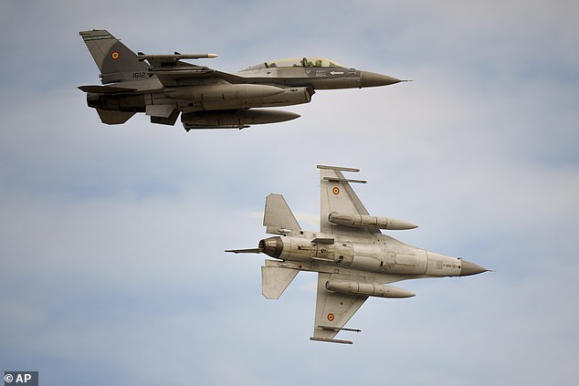 File photo. Romanian air force F-16 fighter planes fly above the Baza 86 military air base, outside Fetesti, Romania, Monday, Nov. 13, 2023