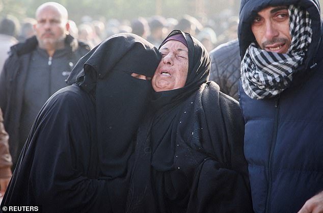 Mourners react near the bodies of Palestinians killed in Israeli airstrikes, amid the Israel-Hamas conflict, at Nasser hospital in Khan Younis, southern Gaza Strip, January 17, 2025