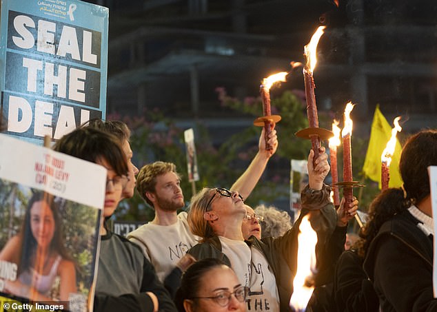 Protesters calling for the return of hostages held in the Gaza Strip react after a Gaza ceasefire and hostage release deal was reached on January 16, 2025 in Tel Aviv, Israel