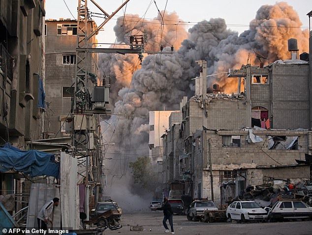 Smoke rises from a building destroyed in Israeli airstrike at the Bureij camp for Palestinian refugees in the central Gaza Strip on January 12, 2025