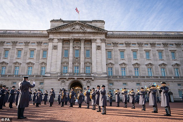 The new lights will be planned for the Forecourt and Ambassador's Court within Buckingham Palace - pictured is The RAF band playing during the Changing of the Guard ceremony