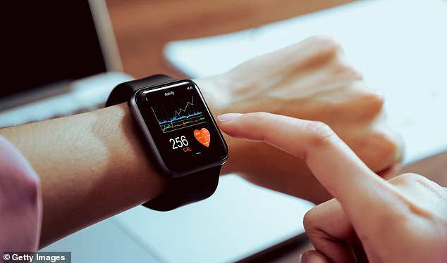 Mintel is now urging leading brands such as Apple and Garmin to encourage ‘digital detoxes’ or offer an option which tracks health weekly (file image)