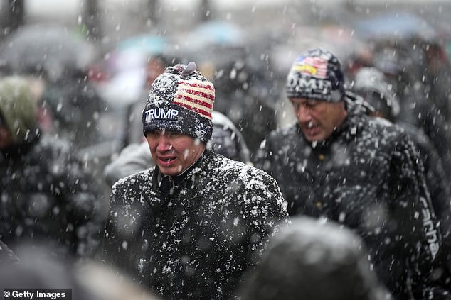 Supporters stood in rain, sleet, snow and freezing conditions for their chance to see Trump speak once more before inauguration ¿ thousands were left out of the arena