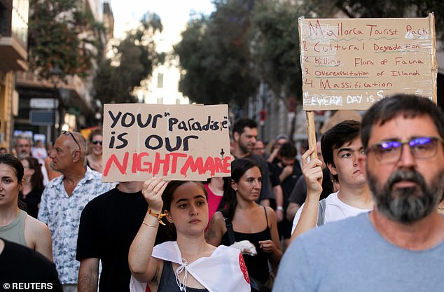 People take part in a protest against mass tourism in Palma de Mallorca, Spain, July 21, 2024