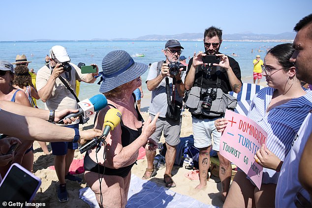 Members of the Mallorca Platja Tour association demonstrate against the tourist saturation on the beach of Palma de Mallorca on August 11, 2024