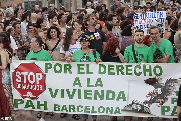 People attend an anti tourism protest under the motto 'Enough! Let's put limits on tourism' organised by different civil society groups in Barcelona, Catalonia, Spain, 06 July 2024