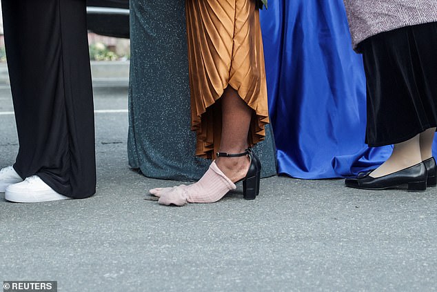 One woman tried to cover her toes with a pair of socks placed over the top of her heels