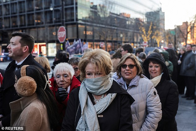 Others covered their faces in an effort to shield themselves from the cold