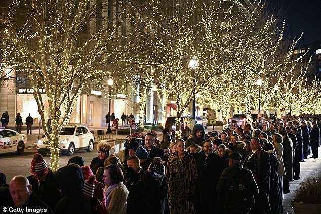 People wait to enter the Liberty Inaugural Ball where President Donald Trump is expected later in the evening