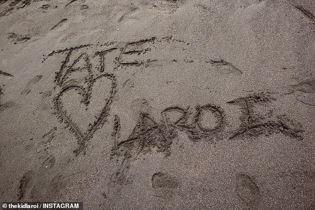 Tate expressed her love for her boyfriend by writing their names in the sand with a heart