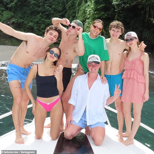 They were joined on the sun-filled beach trip by friends Olivia Rodrigo and Louis Partridge, also both 21, who are also dating (pictured left)