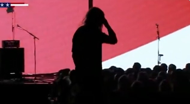 In another awkward sequence, Cyrus' silhouette was seen walking around on the stage while the music played behind him