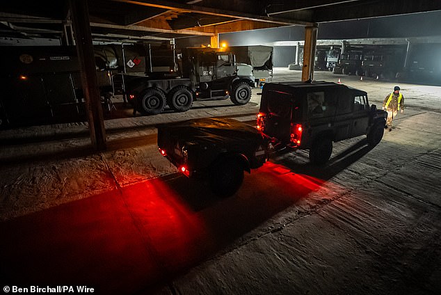 British military vehicles are marshalled as they arrive at a Hungarian military base on Tuesday