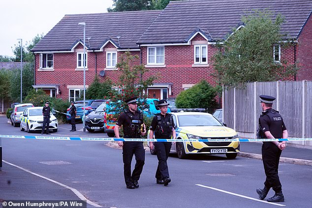 Police officers outside the home of Rudakubana in Banks, Lancashire, on July 30, 2024