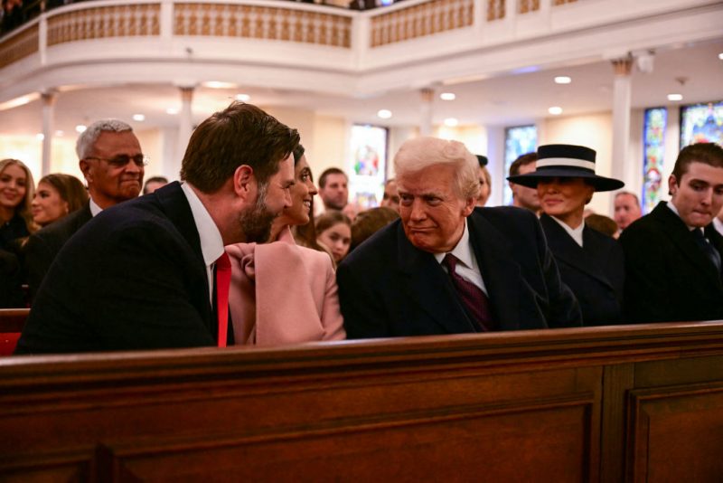 US President-elect Donald Trump speaks with Vice President-elect JD Vance (L) during a church service at St. John's Episcopal Church, Lafayette Square in Washington, DC, January 20, 2025. (Photo by Jim WATSON / AFP) (Photo by JIM WATSON/AFP via Getty Images)