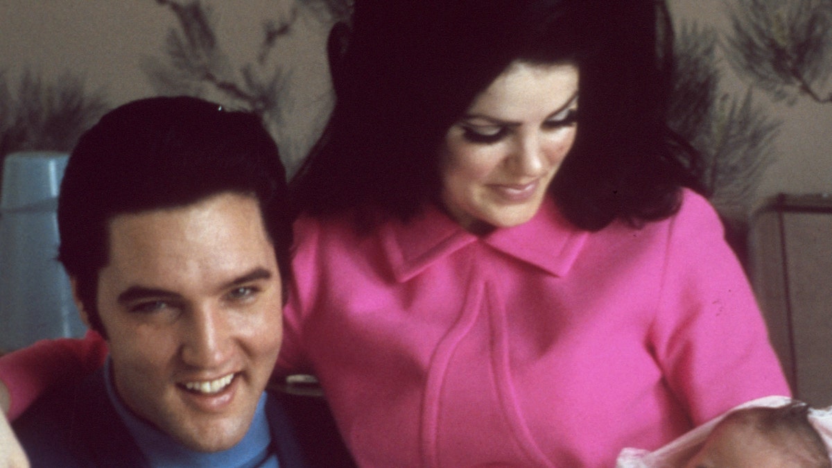 Elvis and Priscilla Presley with their newborn daughter Lisa Marie