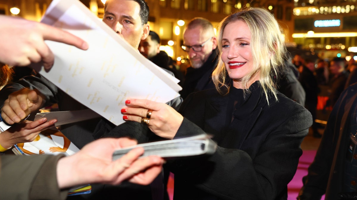 Cameron Diaz signs autographs