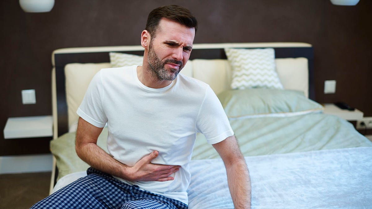 man suffering from a stomachache