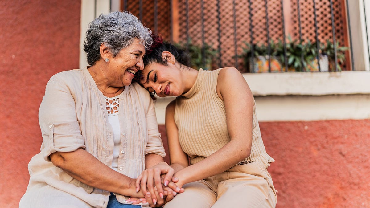 Grandmother and granddaughter together outdoors