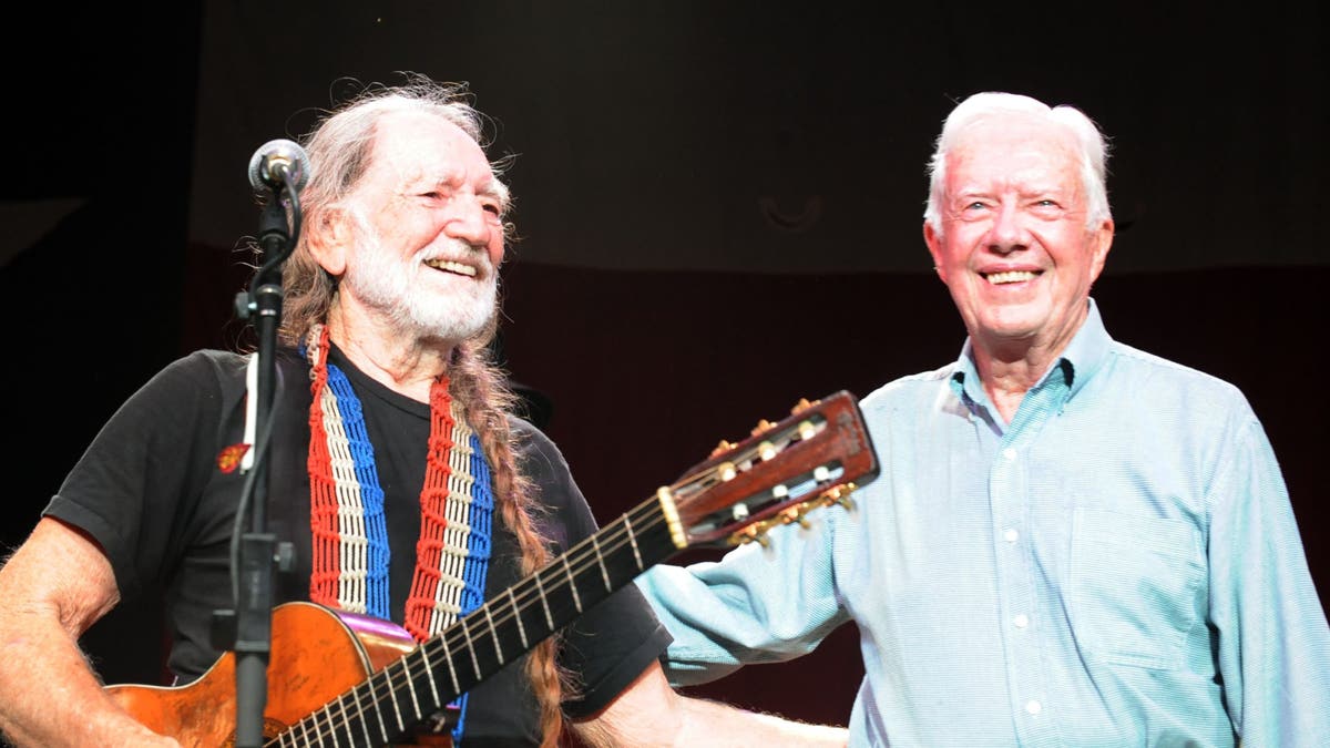 Jimmy Carter on stage with Willie Nelson