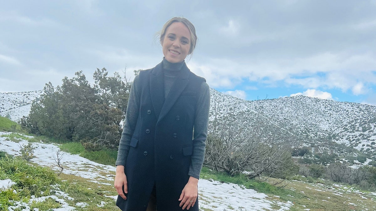 Jinger Duggar Vuolo smiling outside in the snow.