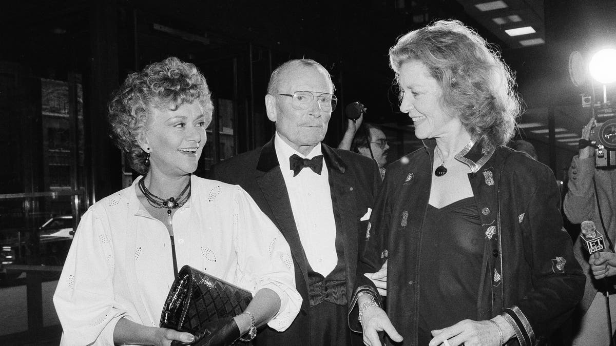 A photo of Joan Plowright, Laurence Olivier and Lauren Bacall