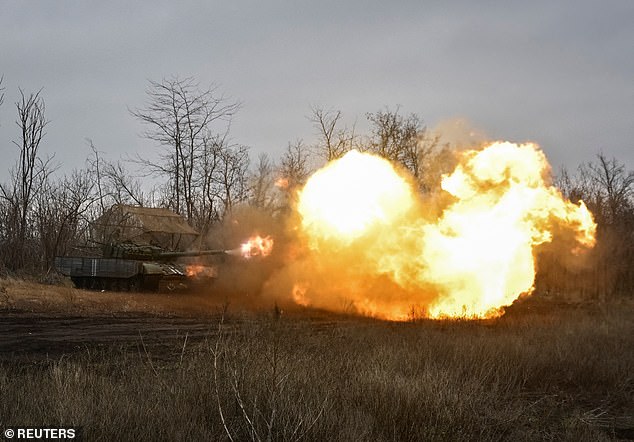 Servicemen of the tank battalion of the 128th Mountain assault Transcarpathian Brigade of the Armed Forces of Ukraine fire a tank during a training, amid Russia's attack on Ukraine