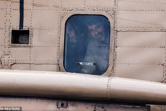 A released hostage Or Levy, who was seized during the deadly October 7 2023 attack by Hamas, is seen with his brother through a window of a helicopter that lands at Sheba Medical Center, for treatment following his release from Gaza, in Ramat Gan, Israel, February 8, 2025